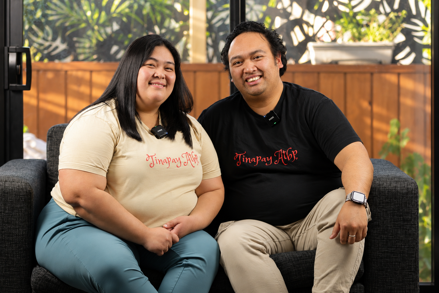 The founders of Tinapay Atbp seated together in their branded shirts